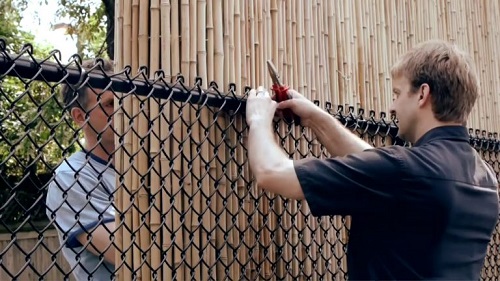 Black Chain Link Fence with Bamboo Screens